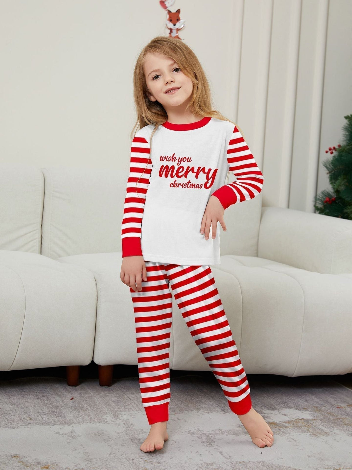 Red and White Striped Family Christmas Pajamas - model wearing